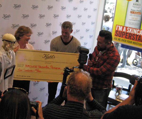 Kiehl's US president, Chris Salgrado presents the check to the homeless prenatal program.  photo by Paul d'Orleans