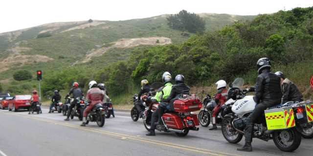 Motorcyclists waiting for a green light to go through the tunnel. photo by Paul d'Orleans