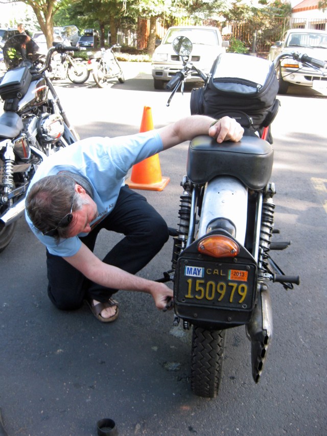 Dai-checks-nuts-and-bolts-on-the-Endurance Dai checks the nuts and bolts on the Endurance.