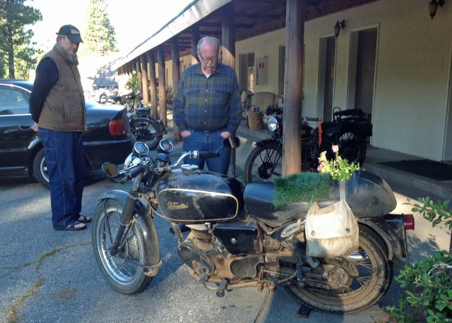 Jeff S. and Fred look at the bikes parked in front of the lodge