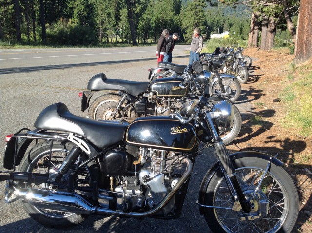 Velocettes and other bikes parked outside of the Mineral Lodge