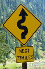 77 mile curve sign