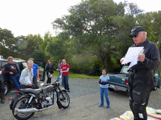 John Ray hosts riders meeting to a somewhat attentive audience